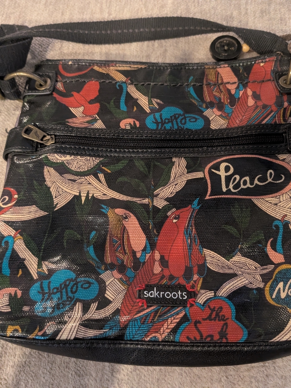 Sakroots Black Crossbody Bag with Red, Blue and Cream Bird Print